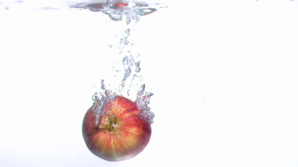 193828443-sinking-apple-fruit-falling-procedure-splashing-liquid